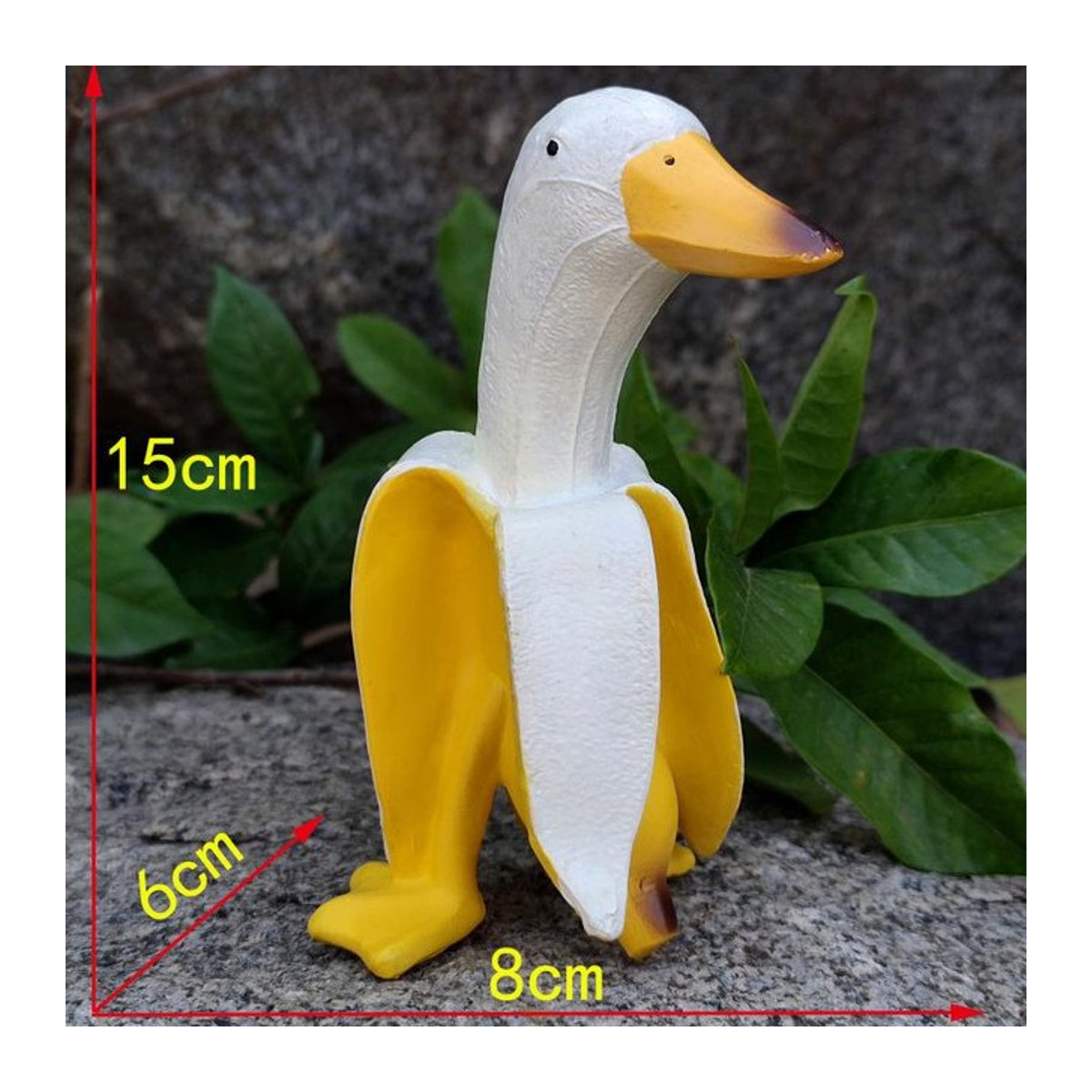Kreative Bananen-Ente als skurrile Gartendekoration und Vintage-Skulptur aus Harz in Gelb - Bild 1